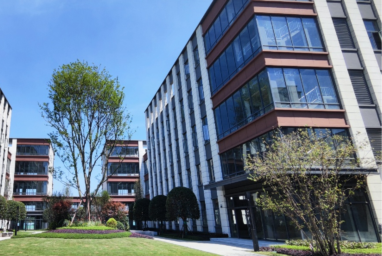 LianDong U Valley corporate office building exterior with white and brown facade and green lawn